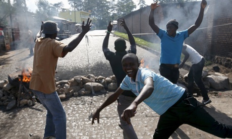 Anti Nkurunziza protesters in front of a barricade in Bujumbura