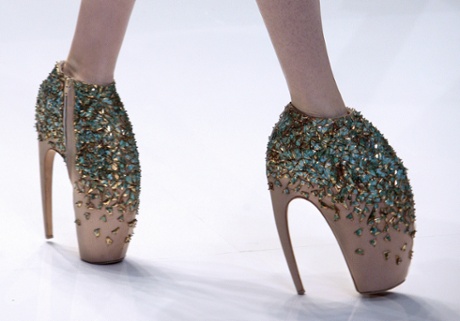 A model presents an outfit by British designer Alexander McQueen during ready-to-wear Spring-Summer 2010 fashion show.