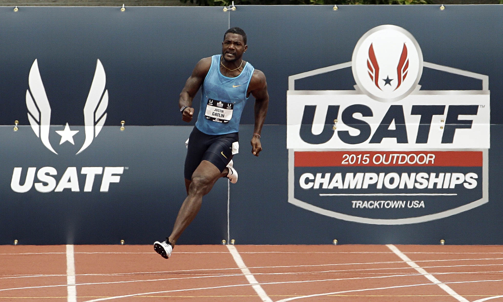 US trials: Justin Gatlin eases up on bend but wins easily in 200m qualifier