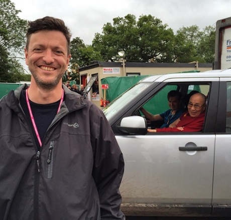 Guardian journalist Caspar Llewellyn Smith and the Dalai Lama, at Glastonbury festival 2015