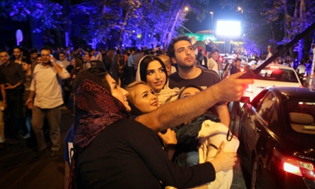 Iranians celebrate the nuclear agreement in Tehran.