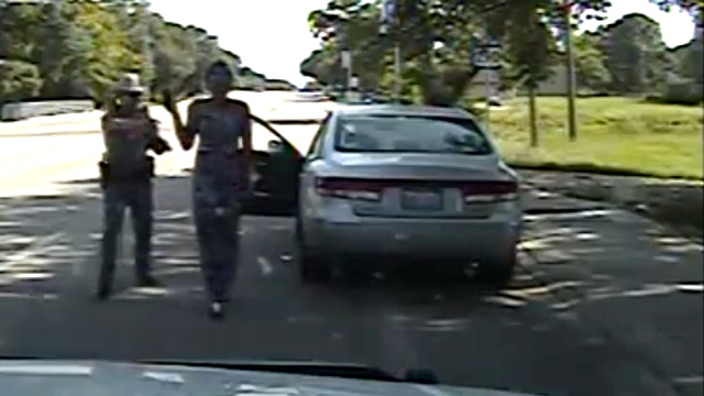 Sandra Bland dashcam video shows officer threatened: 'I will light you | Bland | The Guardian