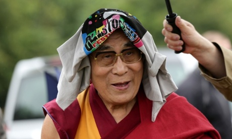The Dalai Lama arrives at Glastonbury festival.