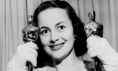 Olivia de Havilland in 1950 with her Oscars.