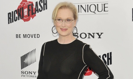 Meryl Streep wears a black dress and large black hoop earring, her hair tied back with a loose fringe, for a photocall for her new film Ricki and the Flash