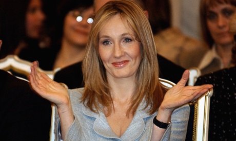 British author JK Rowling applauds while watching a performance by Romanian children in Bucharest January 26, 2006. Rowling, author of the Harry Potter books, is in Romania to take part in a fundraising gala, organised by a Bucharest-based foundation called The Children's High Level Group.