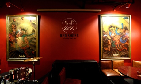 Artwork depicting the gods Raijin and Fujin on the walls of the Red Shoes club, Tokyo, Japan.