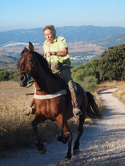 Andalucia: Karen cantering up a hill