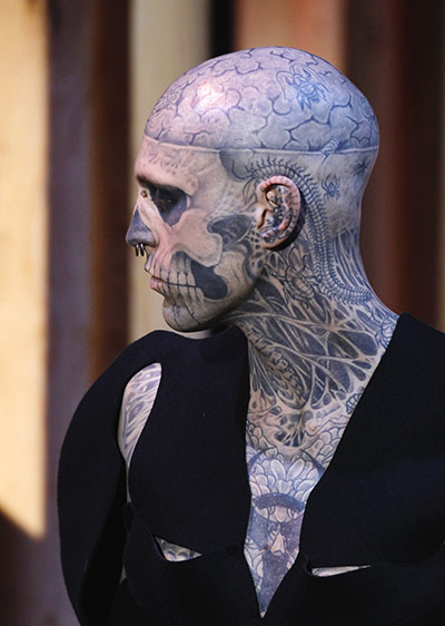 Paris FW - Tuesday shows: A tattooed model presents a creation for Thierry Mugler
