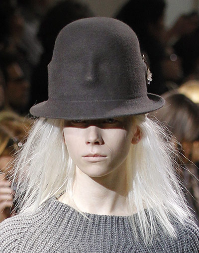 Paris FW - Tuesday shows: A model wears a hat by Japanese designer Limi Feu