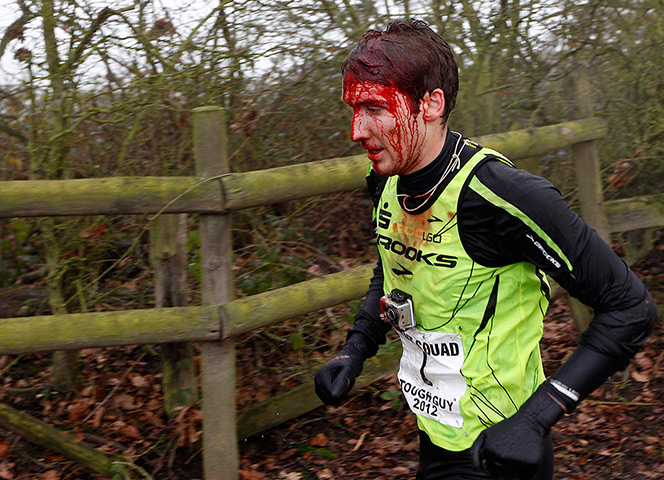 Tough Guy: A competitor bleeds from a head wound during the Tough Guy Challenge 2012