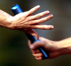 The baton is passed in a relay race 