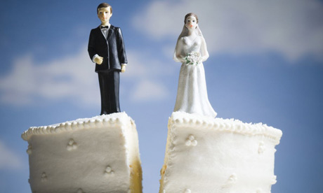 Divorced couple on wedding cake 