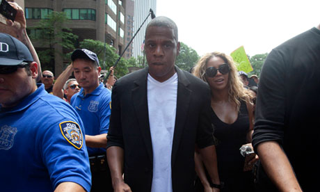 Singer Beyonce and her husband depart from a rally for Trayvon Martin in New York