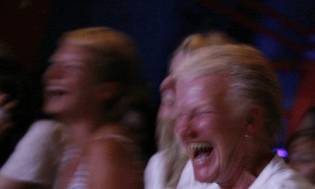 An audience laughing. Photograph: Dan Chung