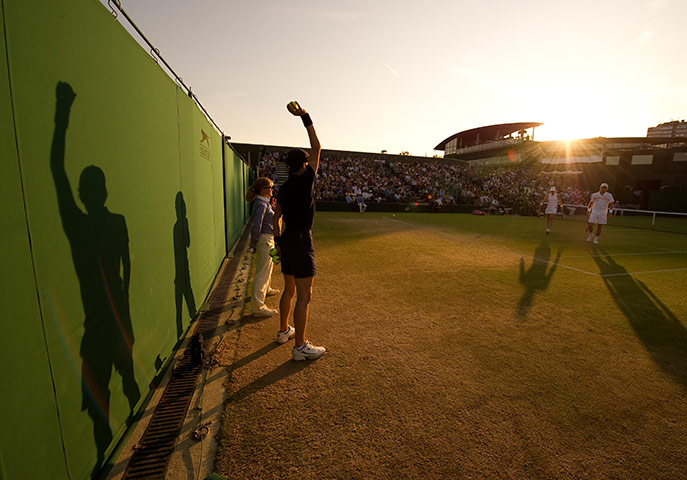 Wimbledon photo book: Sun set over court 5 during a mixed doubles match