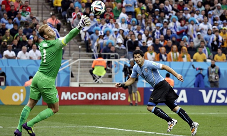 Uruguay's Luis Surez scores with his head in the first half as England's Joe Hart can only watch th