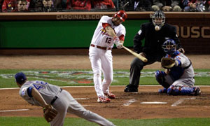 St. Louis Cardinals Lance Berkman embraces Albert Pujols after the  Cardinals won the 2011 World Series in St. Louis on October 28, 2011. The  Cardinals defeated the Texas Rangers 6-2 winning game