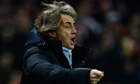 Roberto Mancini's Manchester City give Manchester United title warning