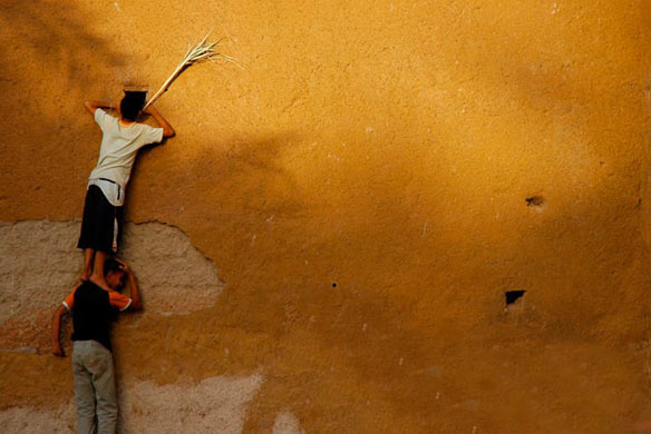 Pictures of the year: Two boys peeking, Morocco