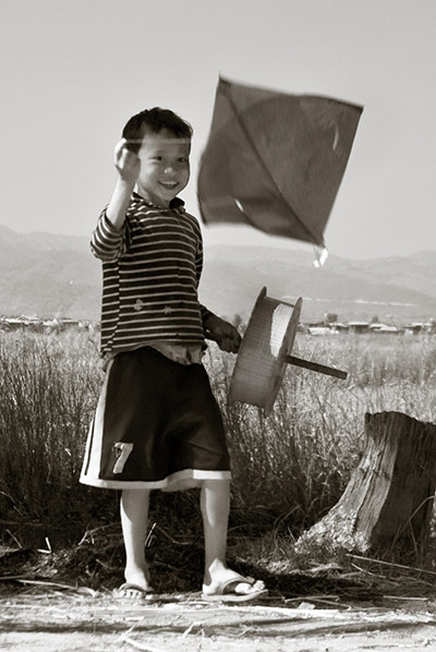 Been there comp Dec 2010: Boy flying kite in Burma