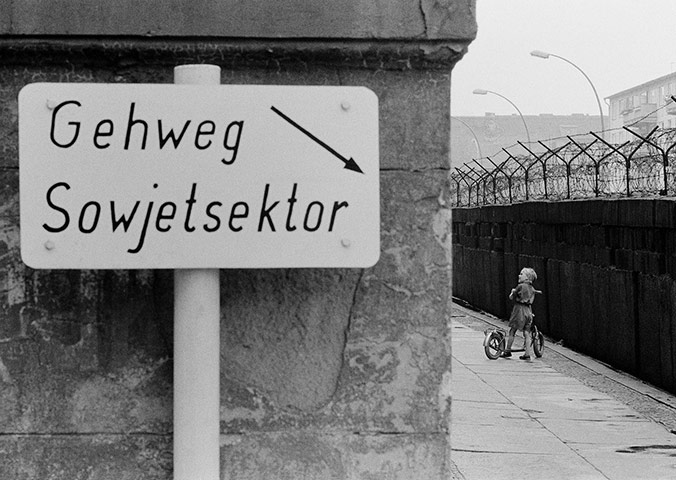 berlin vintage: Children playing at the Berlin Wall