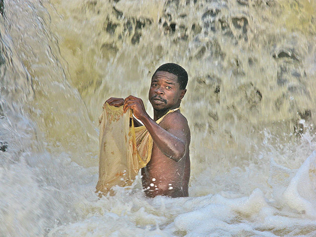 congo: Waterfall fisherman on the Luvua River