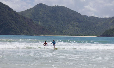 Zac learning to surf, Indonesia