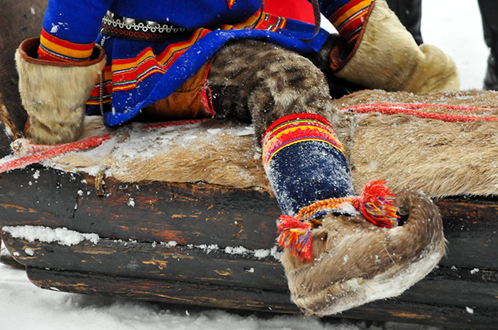 Sami Lapland: A young boy wearing a gákti - native Sámi clothing