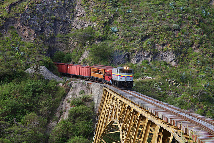 Ecuador train: Train approaches the Bridge over the Ambi river