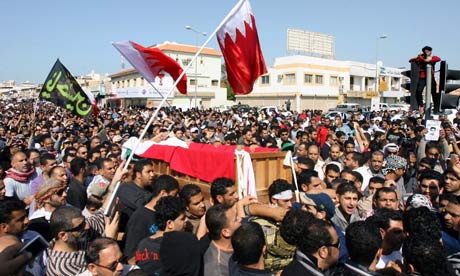 Bahraini Shiite protesters carry the coffin of a an anti-government protester