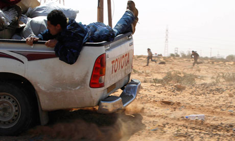 Rebel fighters flee after being ambushed near Sirte, Libya