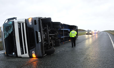 A lorry lies on its side after being blown over in high winds on the A66 in County Durham
