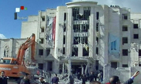 An image from Syrian television shows the scene of a bomb attack in Aleppo